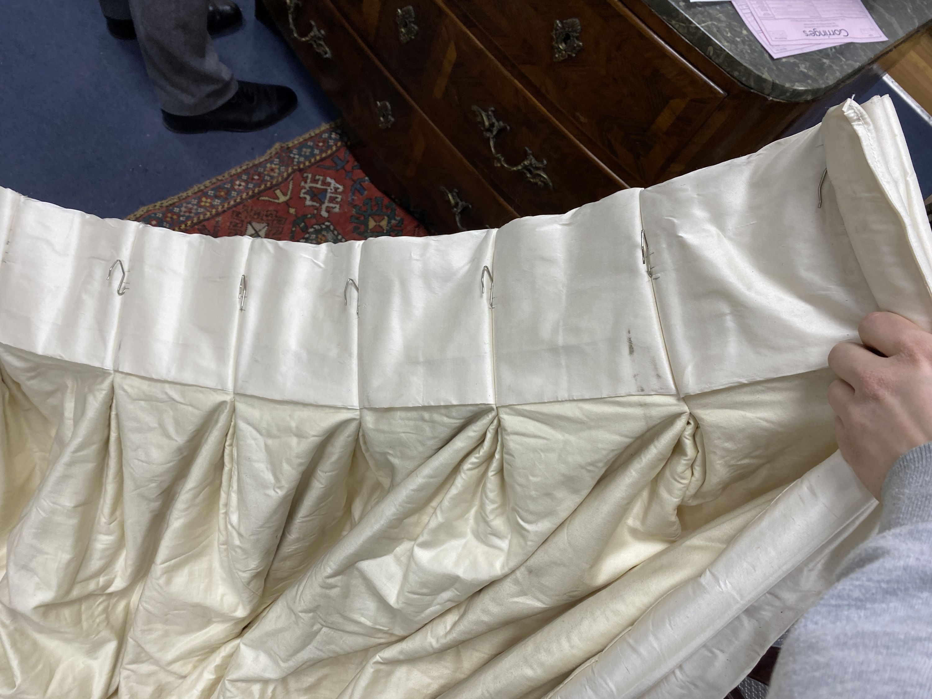 A large pair of cream silk curtains. 100 inches drop